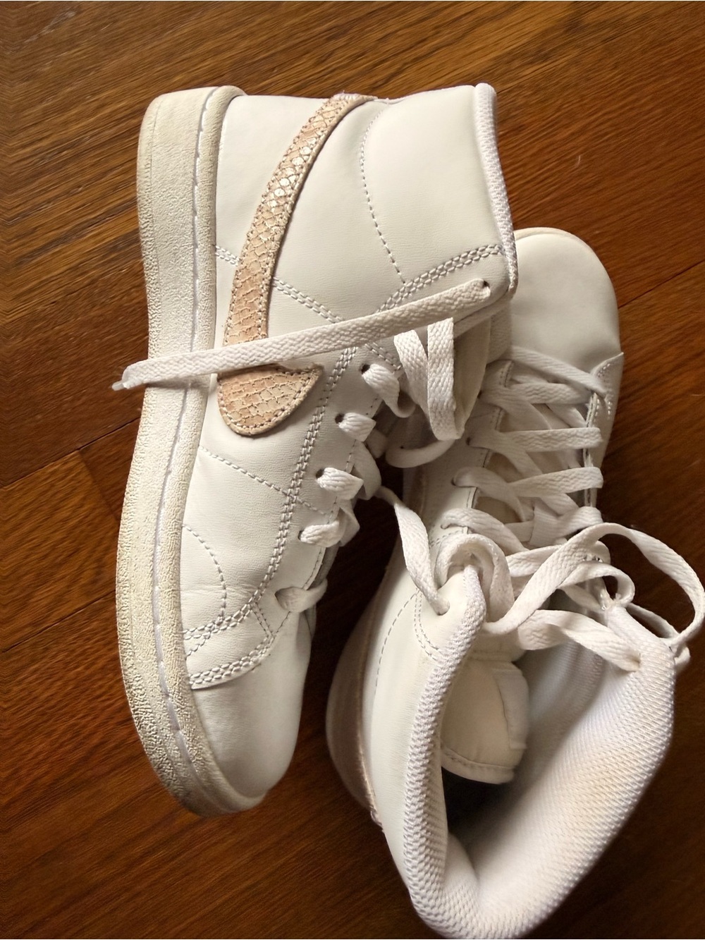 Nike White High-Top Sneakers with Beige Swoosh